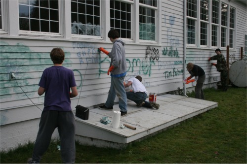 Scouts remove graffiti from Nichols Center